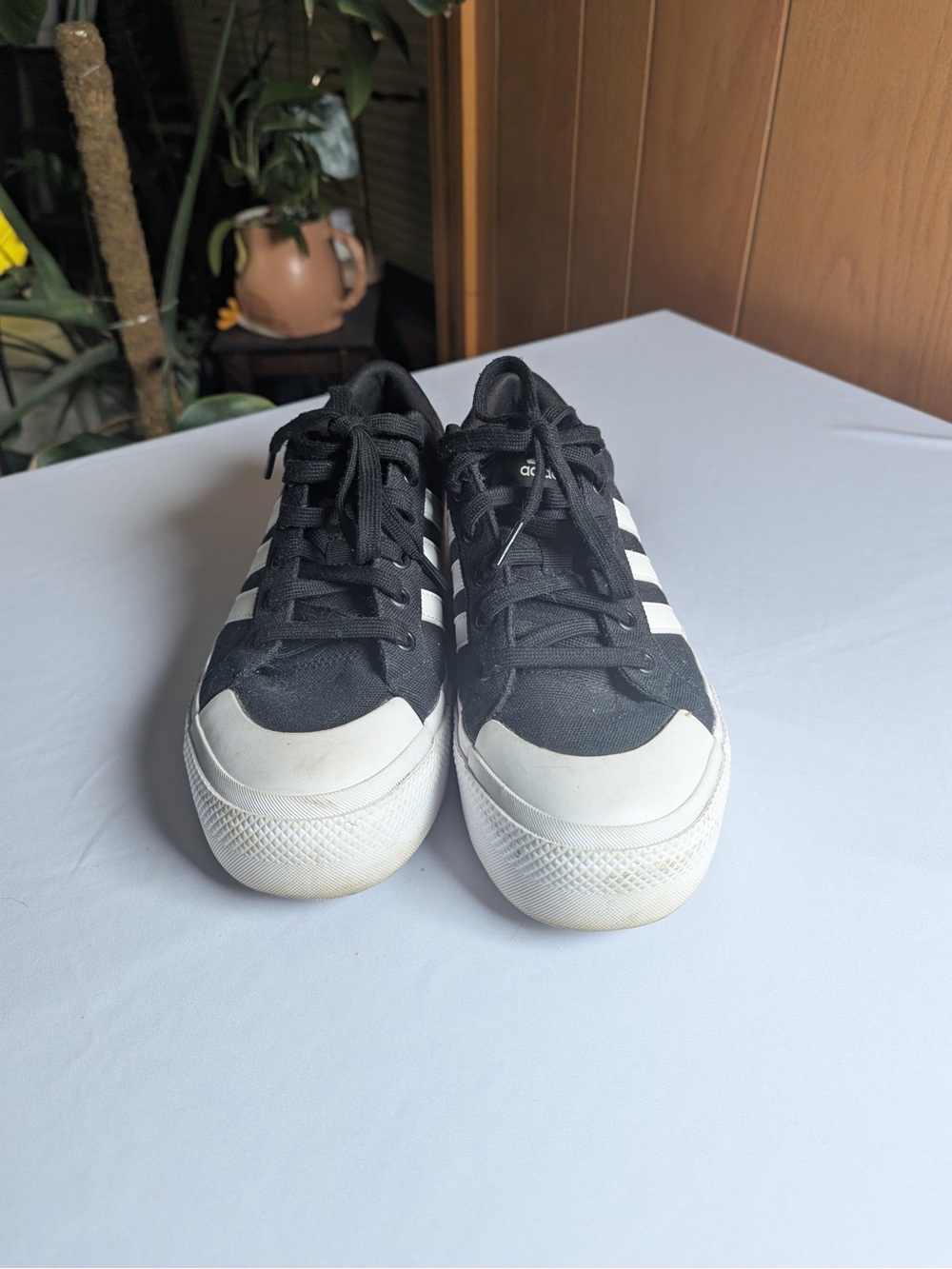 Adidas women’s Black Canvas Low-Top Sneakers with White Stripes